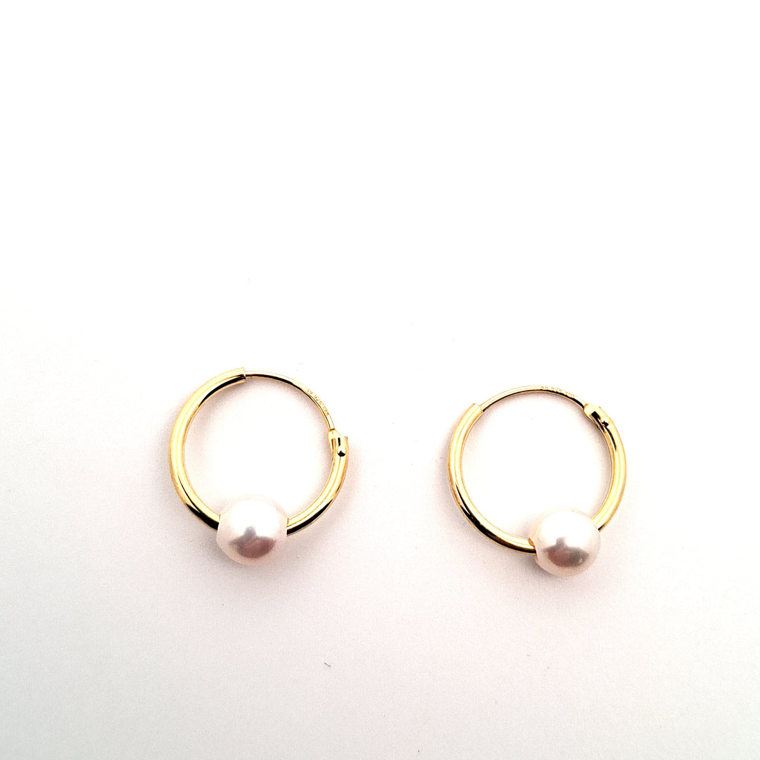 Gold tone pearl slider hoops