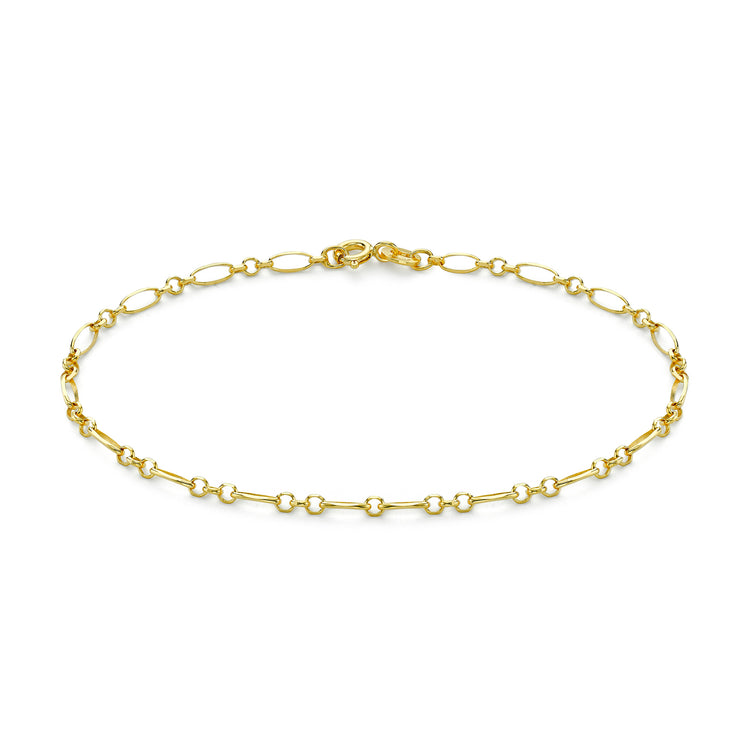 A delicate gold chain bracelet with a mix of elongated oval links and smaller circular links, displayed on a clean white background.