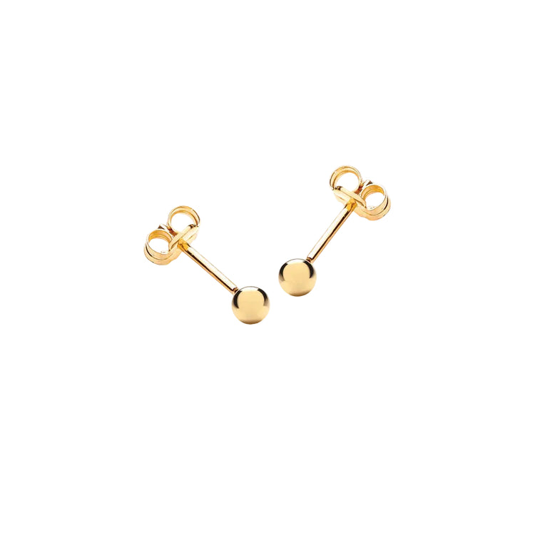 Gold 3mm ball earrings on a light gray background