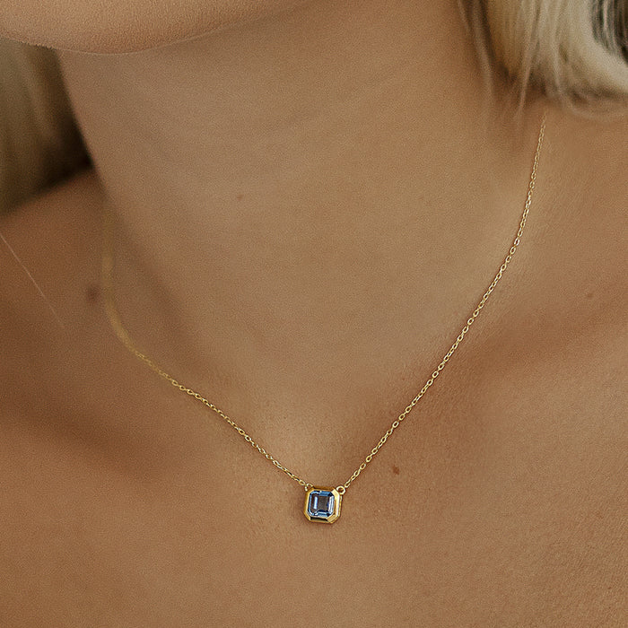 Gold toned square  blue stone pendant 38832