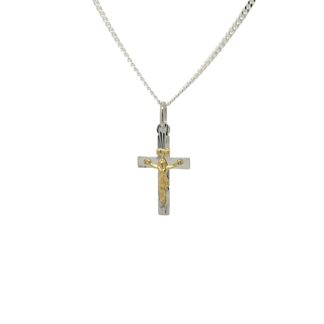 A silver chain necklace with a double-cross pendant, featuring one silver cross and one gold-toned crucifix with a gold figure of Jesus, displayed against a plain light gray background.