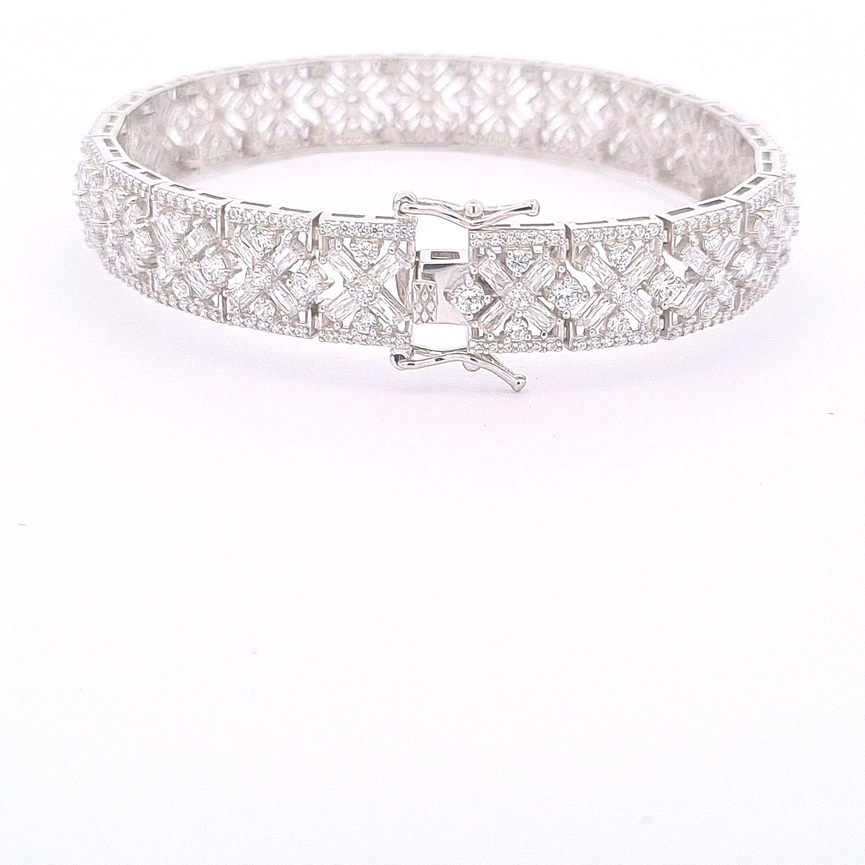 Sterling silver ornate multi stone CZ set panel bracelet with double figure of eight safety catch. 33860 - Armin Lowe Jewellers