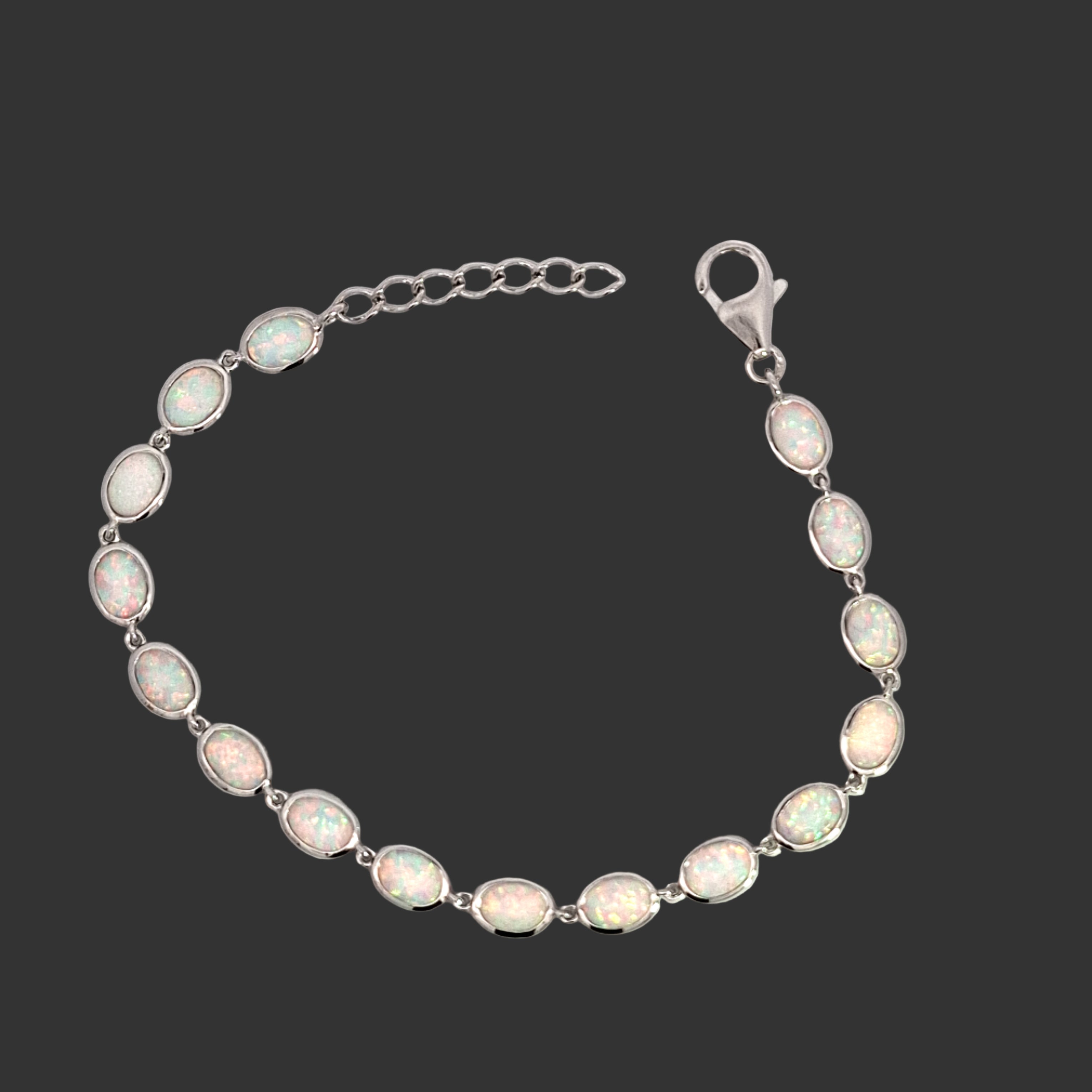 Opal bracelet with silver chain on a white background