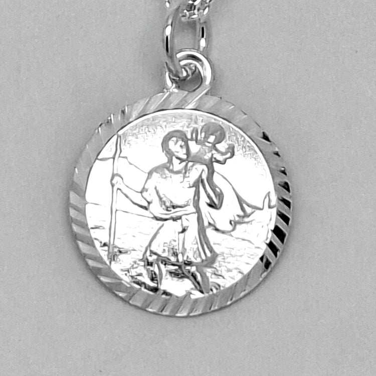 Silver pendant necklace on a gray background
