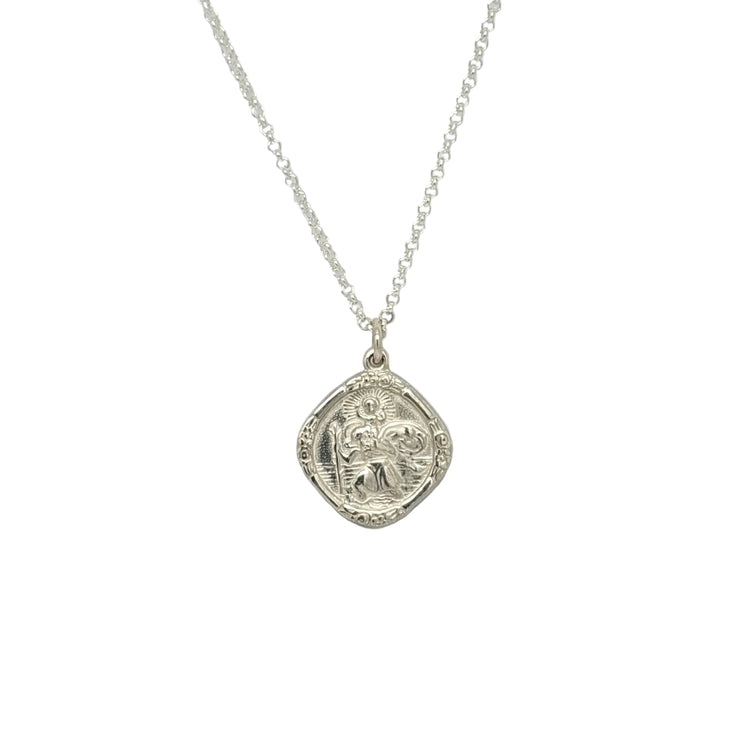 Silver necklace with a detailed pendant on a light gray background