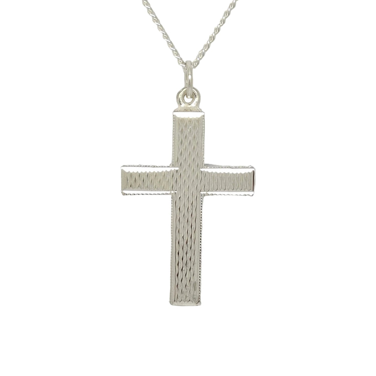 Silver cross pendant on a chain against a light gray background