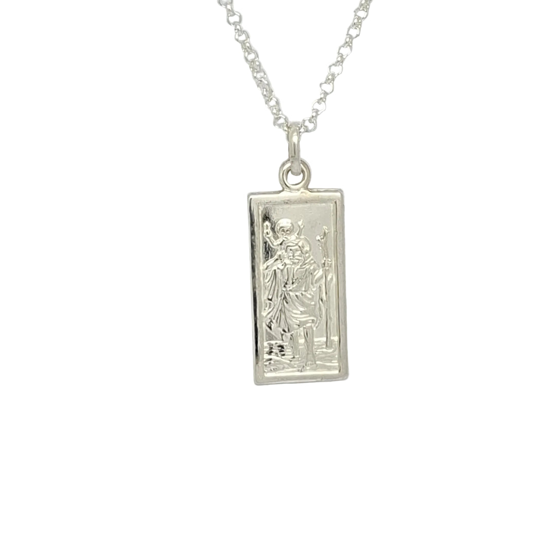 Silver pendant necklace on a light gray background