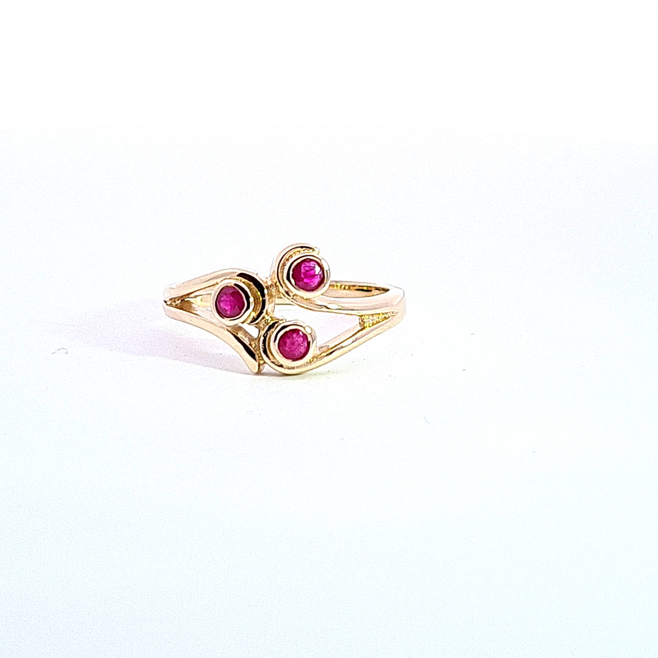 Gold Ruby set Triskell ring 37030 - Armin Lowe Jewellers