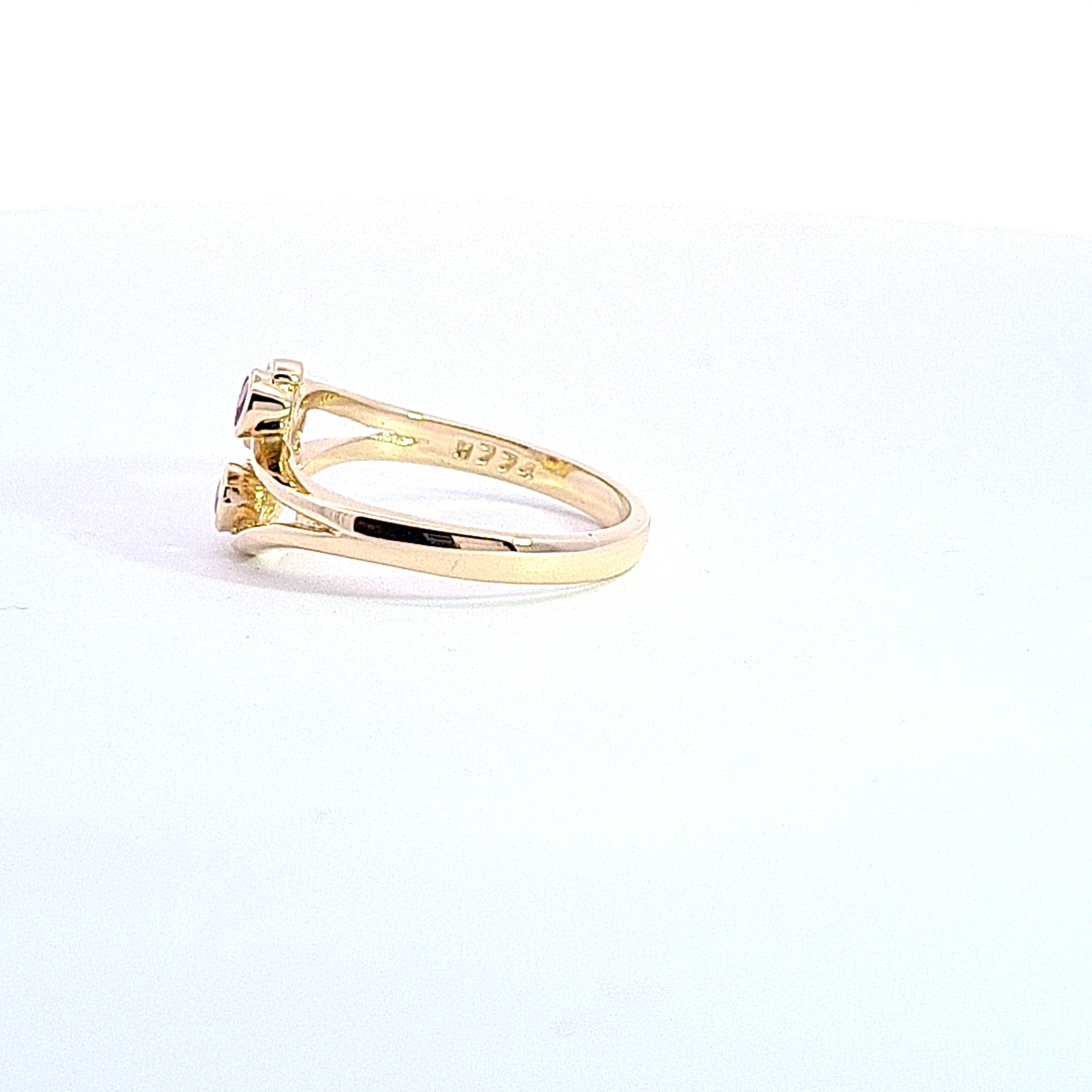Gold Ruby set Triskell ring 37030 - Armin Lowe Jewellers