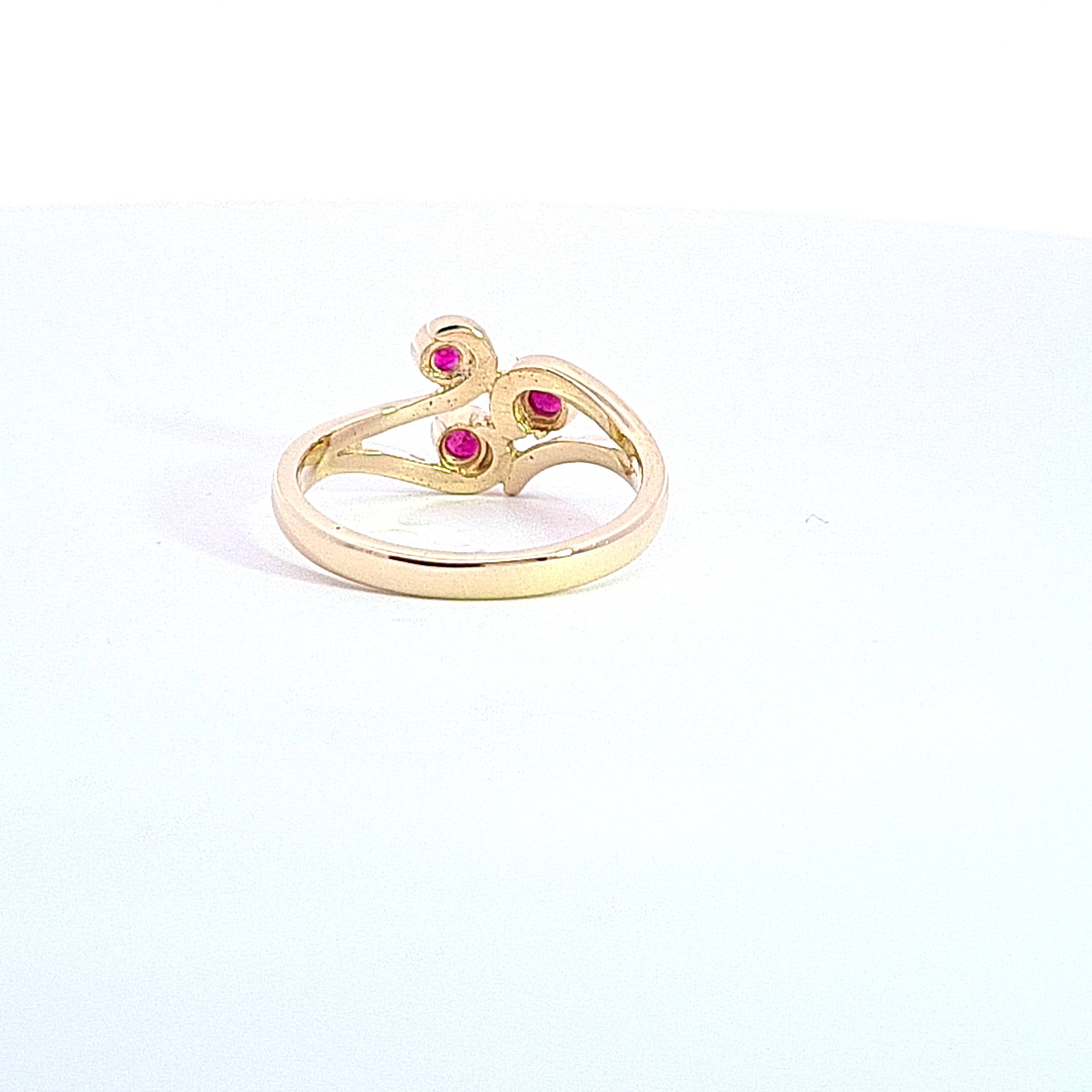Gold Ruby set Triskell ring 37030 - Armin Lowe Jewellers