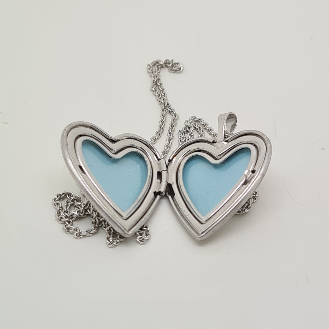 Sterling silver heart locket with Trinty knot pattern 34725