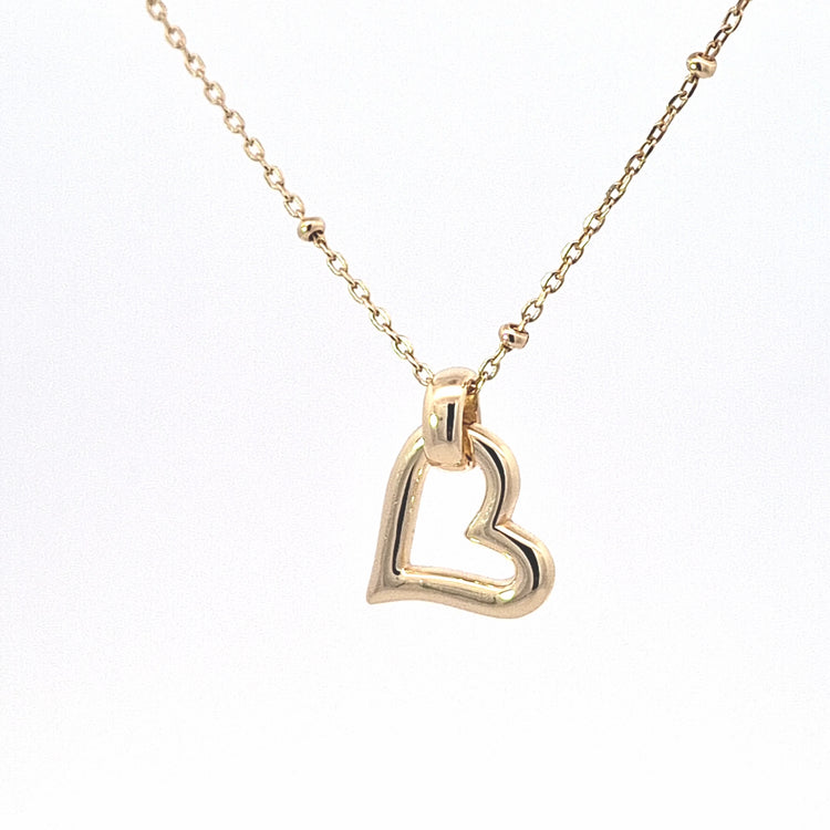 A gold heart-shaped pendant necklace with an open heart design, suspended from a delicate gold chain on a plain white background.