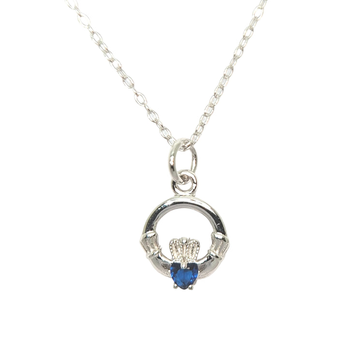 Silver necklace with a heart-shaped blue gemstone pendant on a white background