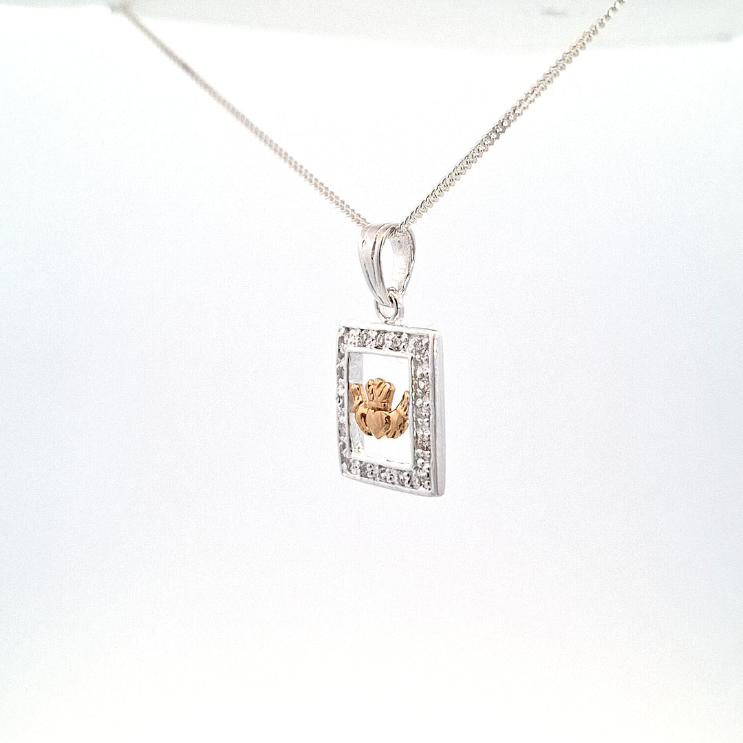 Gold tone Claddagh pendant set within silver stone set Frame 38747