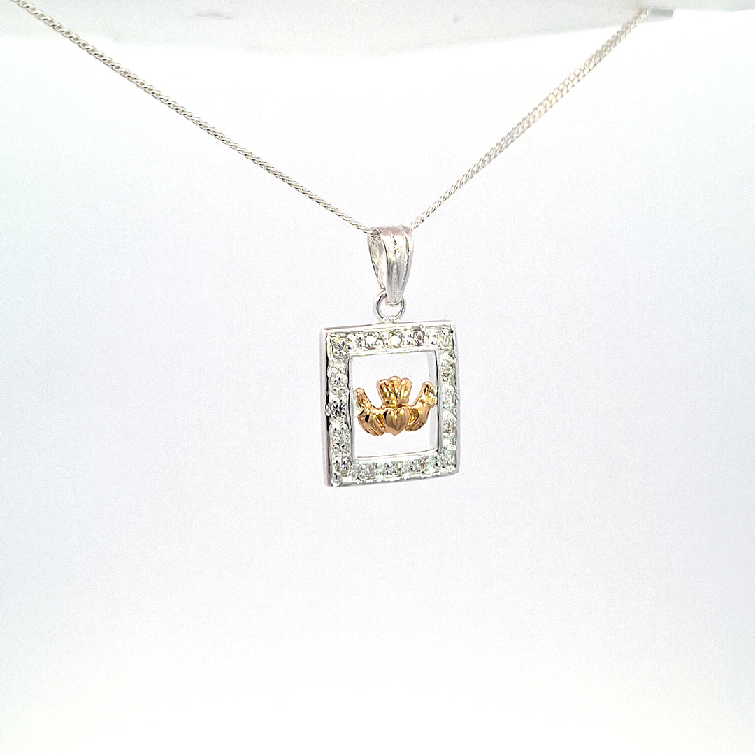 Gold tone Claddagh pendant set within silver stone set Frame 38747