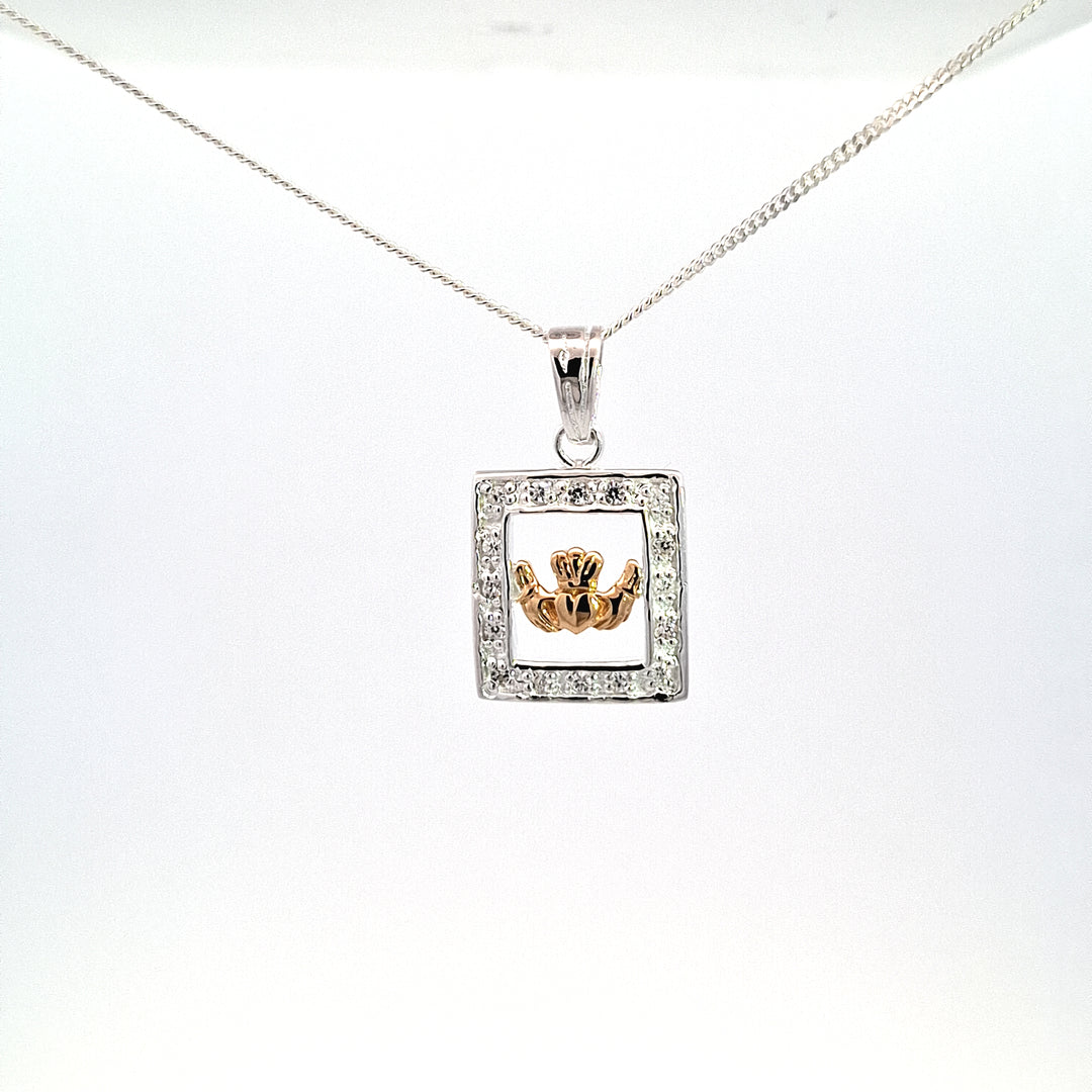 Gold tone Claddagh pendant set within silver stone set Frame 38747