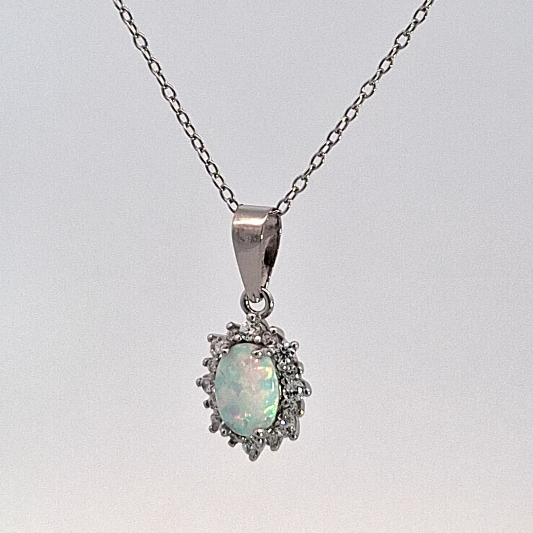 Silver oval Opal Halo pendant 38691