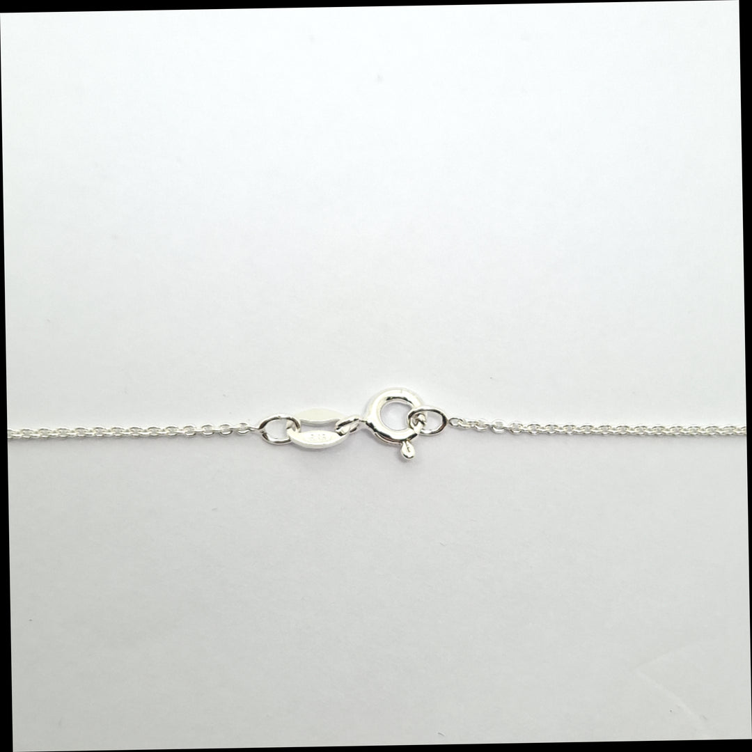 Silver chain necklace on a white background