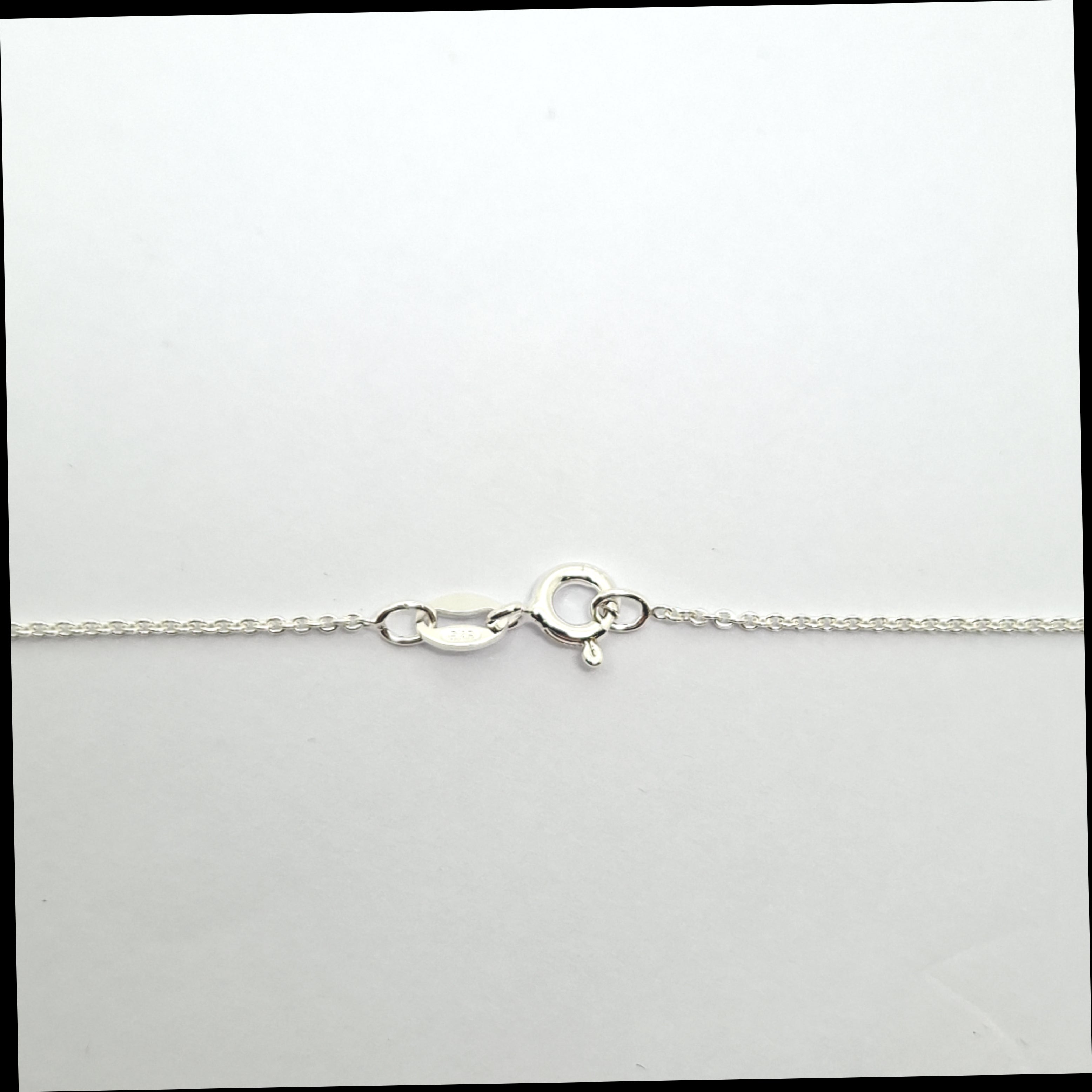 Silver chain necklace on a white background