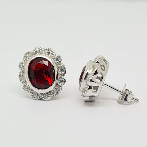 Oval Ruby red CZ rubover set scallop edge earrings 34691