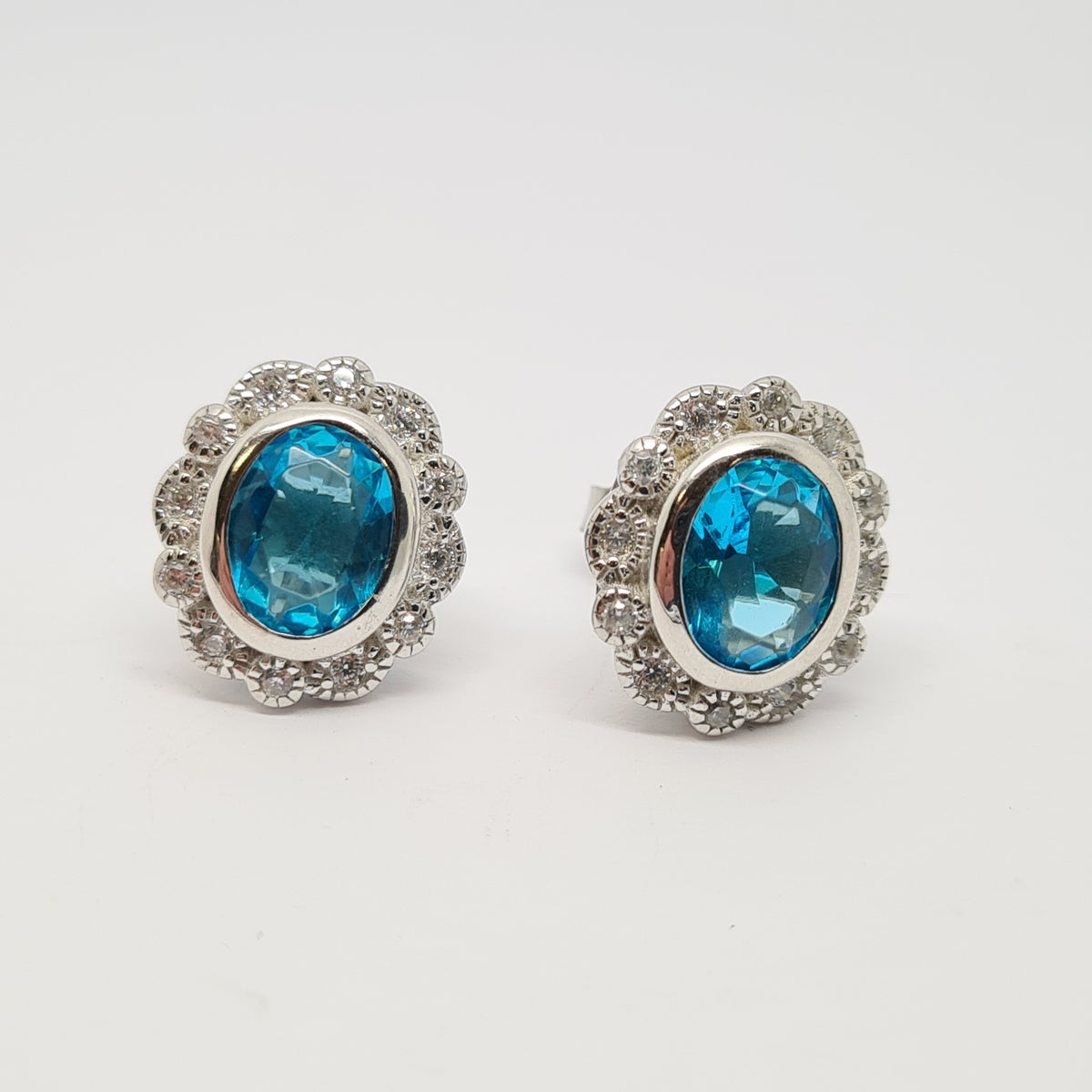 Aqua blue CZ oval cluster stud earrings 35325 - Armin Lowe Jewellers