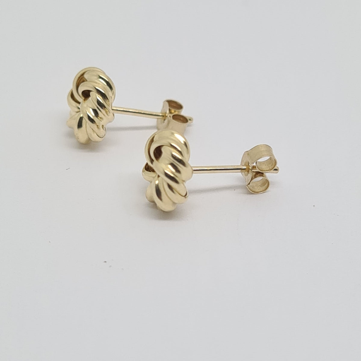 9ct yellow gold knot stud earrings 34241 - Armin Lowe Jewellers